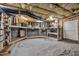 Spacious unfinished basement featuring concrete block walls, a workbench, and room for storage and customization at 124 Mantle Dr, Clayton, NC 27527