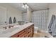 Bathroom with double sinks, marble countertop and bathtub at 124 Mantle Dr, Clayton, NC 27527