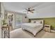 Bright bedroom with ceiling fan, closet, large window at 124 Mantle Dr, Clayton, NC 27527