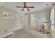 Neutral bedroom featuring a ceiling fan, wall art, and easy access to the bathroom, perfect for a personal space at 124 Mantle Dr, Clayton, NC 27527