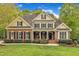 Charming two-story brick home with manicured lawn and landscaping at 124 Mantle Dr, Clayton, NC 27527
