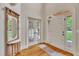 Bright foyer with hardwood floors and decorative mirror at 124 Mantle Dr, Clayton, NC 27527