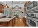 Spacious kitchen featuring stainless steel appliances, an island with countertop, and ample natural light at 124 Mantle Dr, Clayton, NC 27527