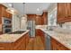 Updated kitchen with granite countertops, stainless steel appliances, and custom cabinets at 124 Mantle Dr, Clayton, NC 27527