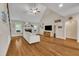 Bright living room with fireplace, hardwood floors, and high ceiling at 124 Mantle Dr, Clayton, NC 27527
