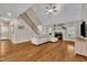 Inviting living room featuring hardwood floors, fireplace, and staircase at 124 Mantle Dr, Clayton, NC 27527