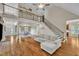 Open concept living room with second story balcony and hardwood floors at 124 Mantle Dr, Clayton, NC 27527