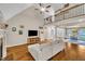 Living room with a fireplace, hardwood floors, and view of the entry at 124 Mantle Dr, Clayton, NC 27527