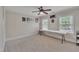 Room with two windows, a ceiling fan, and a table at 124 Mantle Dr, Clayton, NC 27527