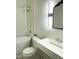 Bright bathroom featuring a modern vanity, stylish mirror, and a classic bathtub with shower at 1310 Pender St, Raleigh, NC 27610
