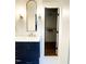 Well-lit bathroom with marble vanity and walk-in closet offering plenty of storage space at 1310 Pender St, Raleigh, NC 27610