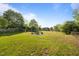 Spacious backyard with a custom built-in fire pit and chain link fence at 1329 Mebane St, Burlington, NC 27217