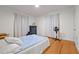 Inviting bedroom featuring hardwood floors, a ceiling fan, and bright natural light at 1329 Mebane St, Burlington, NC 27217
