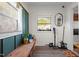 Cozy mud room with built-in bench, natural light, and stylish decor; perfect for organization at 1329 Mebane St, Burlington, NC 27217