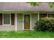Detailed view of the front door with decorative glass panel and address number at 133 Montree Ln, Graham, NC 27253