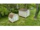 Aerial view of the backyard featuring two storage sheds for organizing outdoor equipment at 133 Montree Ln, Graham, NC 27253