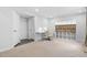 Versatile basement space with a large storage unit and modern white desk at 139 Callowhill Ln, Durham, NC 27713