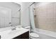Cozy bathroom featuring bathtub, tiled shower with a shower curtain, and single sink at 139 Callowhill Ln, Durham, NC 27713