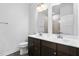 Bathroom featuring a double sink vanity with dark wood cabinets and modern fixtures at 139 Callowhill Ln, Durham, NC 27713