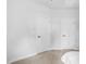 Clean bedroom featuring neutral carpeting, ceiling AC vent, and two white doors at 139 Callowhill Ln, Durham, NC 27713