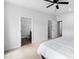 Bright bedroom with a ceiling fan and an open doorway to the ensuite bathroom at 139 Callowhill Ln, Durham, NC 27713