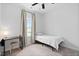 Small bedroom featuring a twin bed, desk, and window with a view at 139 Callowhill Ln, Durham, NC 27713