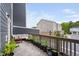 Spacious deck with lounge seating and a row of potted plants at 139 Callowhill Ln, Durham, NC 27713