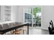 Bright dining area with access to the patio and seating for four at 139 Callowhill Ln, Durham, NC 27713