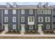 Charming townhome with gray siding, multiple windows and light green doors at 139 Callowhill Ln, Durham, NC 27713
