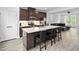 Open-concept kitchen with island seating seamlessly connects to the living area at 139 Callowhill Ln, Durham, NC 27713