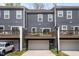 Charming townhome with a private balcony, an attached garage and siding in a modern color at 139 Callowhill Ln, Durham, NC 27713