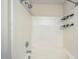 Close up of the bathtub and shower with grab bar and storage caddies at 140 Cedar Elm Rd, Durham, NC 27713