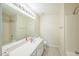 A bright full bathroom with a single sink vanity, large mirror, and shower-tub combo at 140 Cedar Elm Rd, Durham, NC 27713