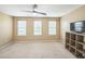 Bedroom offering neutral walls, large windows, and carpeted flooring at 140 Cedar Elm Rd, Durham, NC 27713