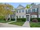 Attractive townhome featuring a manicured front yard and inviting curb appeal at 140 Cedar Elm Rd, Durham, NC 27713