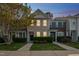 Inviting townhome with cozy front yard and warm exterior lighting at dusk at 140 Cedar Elm Rd, Durham, NC 27713