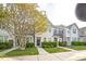 Attractive townhome featuring a manicured front yard and inviting curb appeal at 140 Cedar Elm Rd, Durham, NC 27713