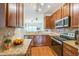 Updated kitchen boasts granite countertops, modern appliances, and a view to the living space at 140 Cedar Elm Rd, Durham, NC 27713