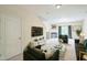 Bright living room with modern decor and a fireplace, perfect for relaxation and entertaining guests at 140 Cedar Elm Rd, Durham, NC 27713