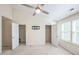 A main bedroom offers two closets, neutral walls, large windows for ample lighting, and a ceiling fan at 140 Cedar Elm Rd, Durham, NC 27713