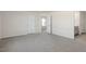 Hallway features neutral carpet, natural light, and doorways to rooms at 144 Global Ave, Fuquay Varina, NC 27526