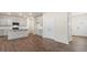 Open-concept kitchen features gray cabinets, a breakfast bar and stainless steel appliances at 144 Global Ave, Fuquay Varina, NC 27526