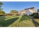 Spacious backyard with a lush lawn and a view of the home's screened porch at 149 Country Mill Way, Fuquay Varina, NC 27526