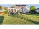 Large backyard with a screened porch, patio, fire pit, and lush landscaping at 149 Country Mill Way, Fuquay Varina, NC 27526
