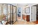 Bathroom with a glass shower, vanity with sink, and access to the bedroom and closet at 149 Country Mill Way, Fuquay Varina, NC 27526