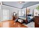 Spacious main bedroom with a vaulted ceiling, hardwood floors, and an ensuite bathroom at 149 Country Mill Way, Fuquay Varina, NC 27526