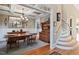 Elegant dining room with hardwood floors, wainscoting, and coffered ceiling, perfect for entertaining and Gathering gatherings at 149 Country Mill Way, Fuquay Varina, NC 27526