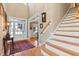 Grand foyer featuring a staircase, hardwood floors, and a view of the front door, creating an inviting entrance at 149 Country Mill Way, Fuquay Varina, NC 27526