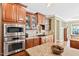 Inviting kitchen boasts ample cabinet space and modern stainless steel appliances at 149 Country Mill Way, Fuquay Varina, NC 27526