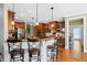 Gourmet kitchen with granite countertops, breakfast bar, and stainless steel appliances at 149 Country Mill Way, Fuquay Varina, NC 27526